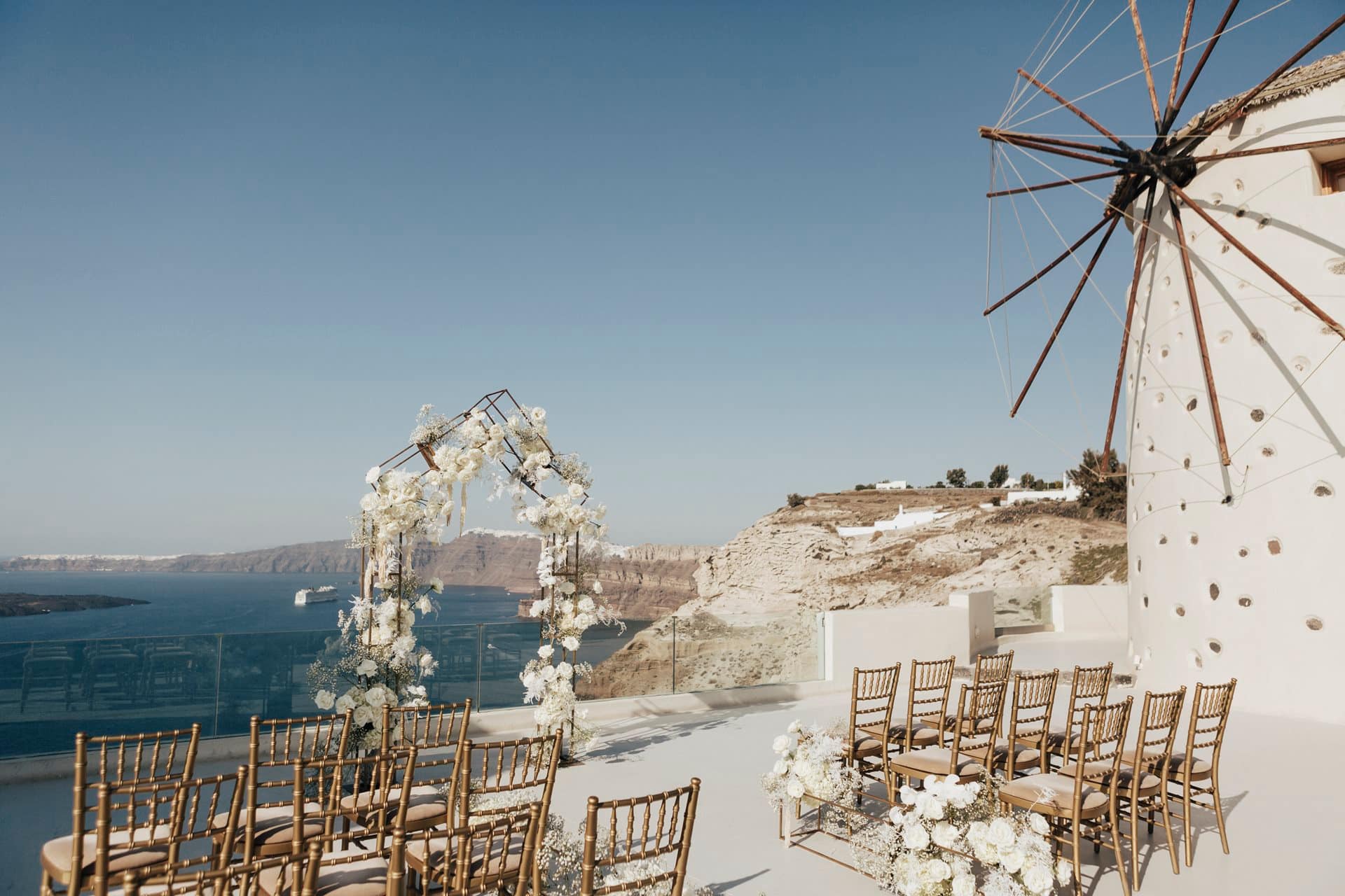 A couple at their Santorini wedding overlooking the Aegean Sea