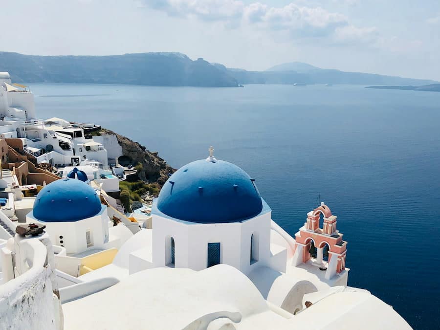 The blue-domed churches of Oia above the Santorini caldera