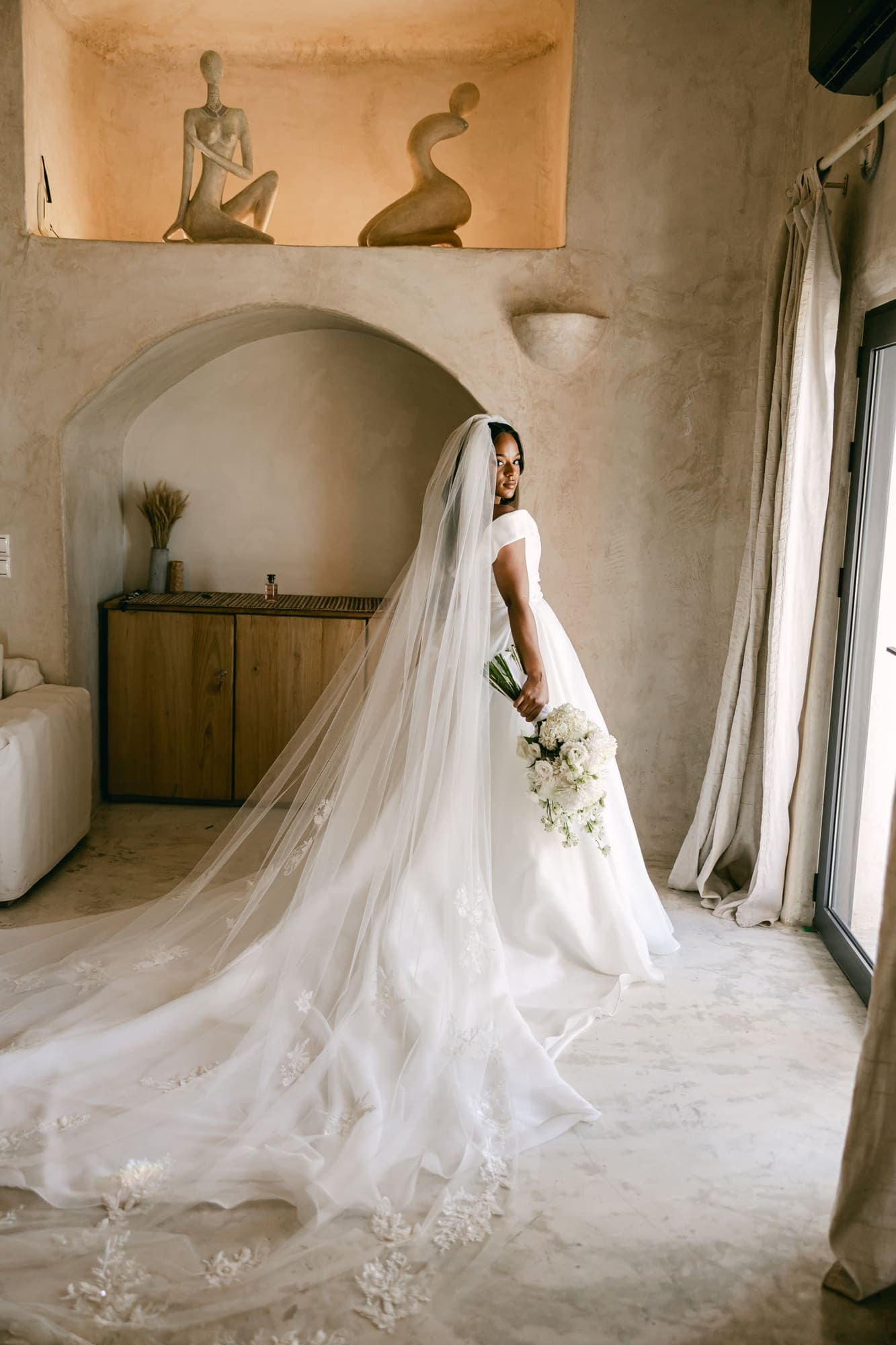 Irlon & Jailleen — the bride in her cathedral veil before the ceremony, Caldera terrace, Santorini
