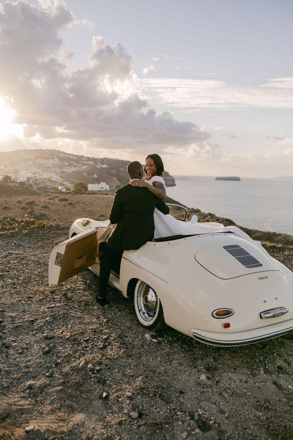 Irlon & Jailleen — sunset portraits with a vintage convertible on the caldera rim, Caldera terrace, Santorini
