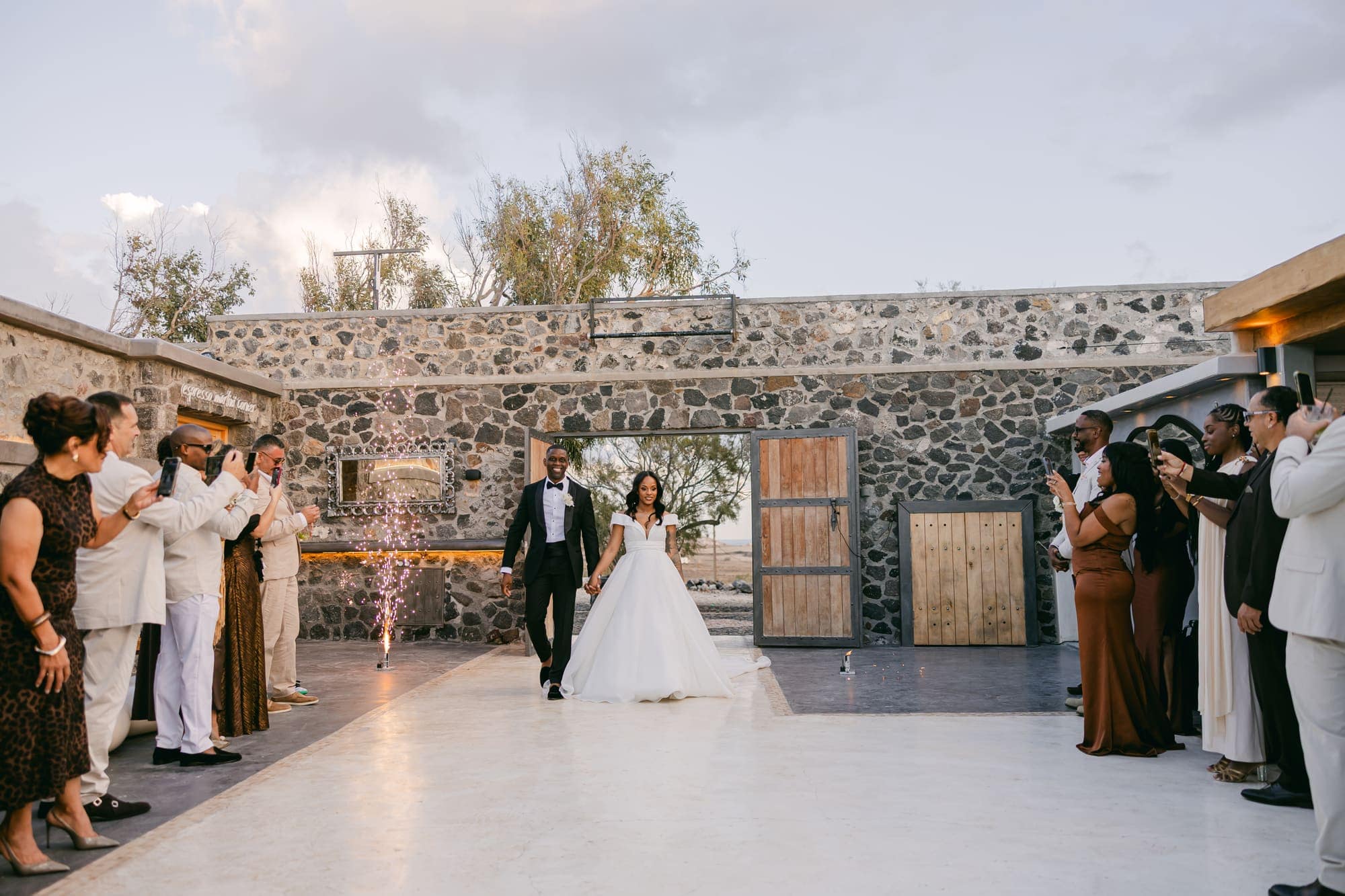 Irlon & Jailleen — the couple's entrance into the reception, Caldera terrace, Santorini