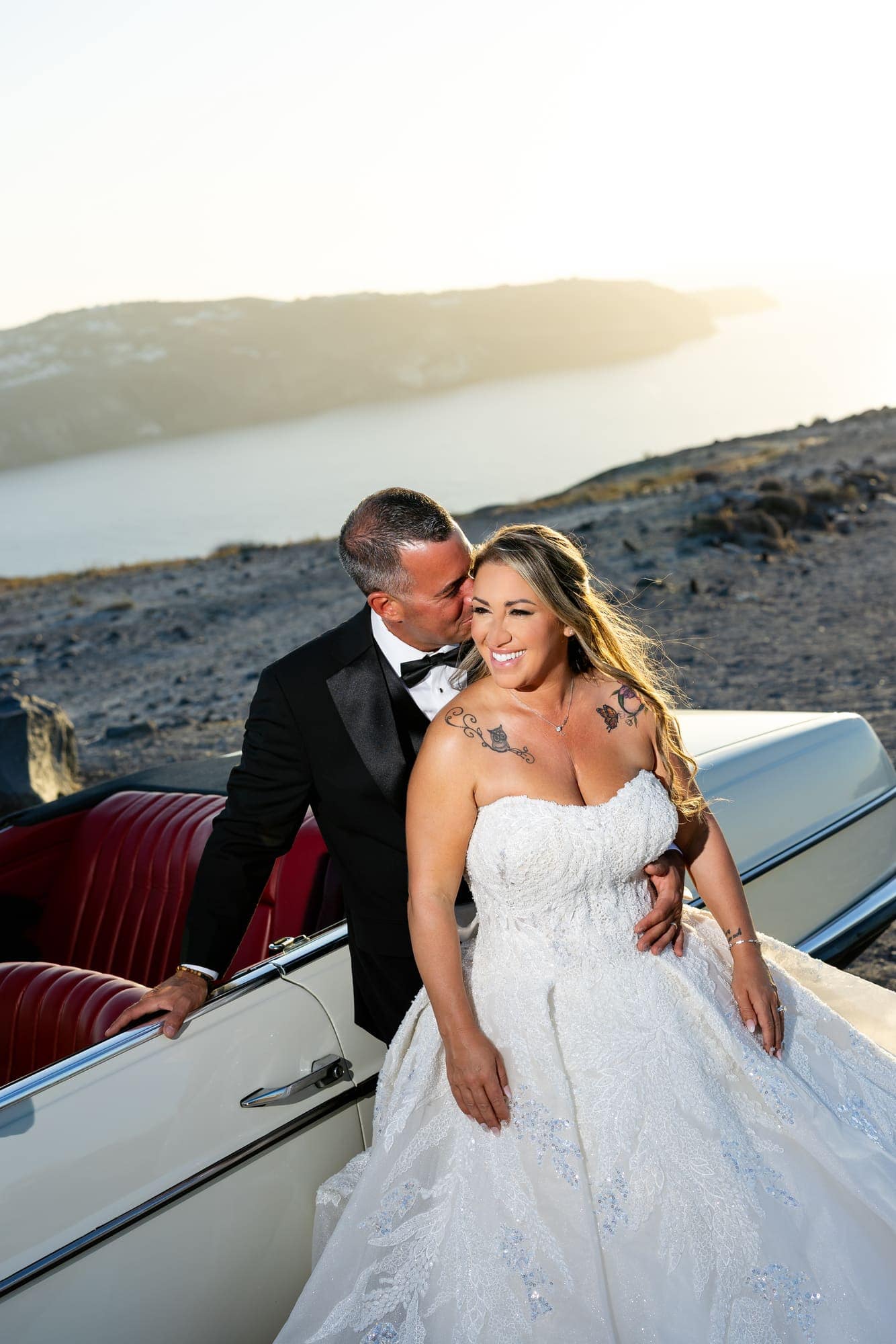 Mary & Chris — the vintage convertible and the blue-domed church, Windmill venue on the caldera, Santorini