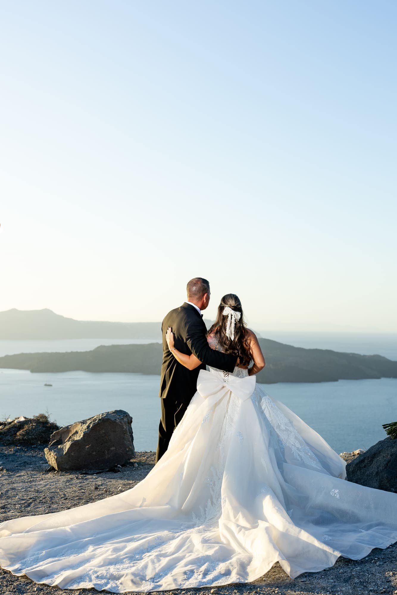 Mary & Chris — the vintage convertible and the blue-domed church, Windmill venue on the caldera, Santorini
