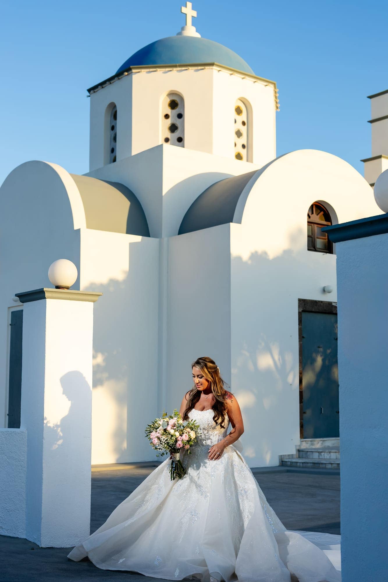 Mary & Chris — the vintage convertible and the blue-domed church, Windmill venue on the caldera, Santorini
