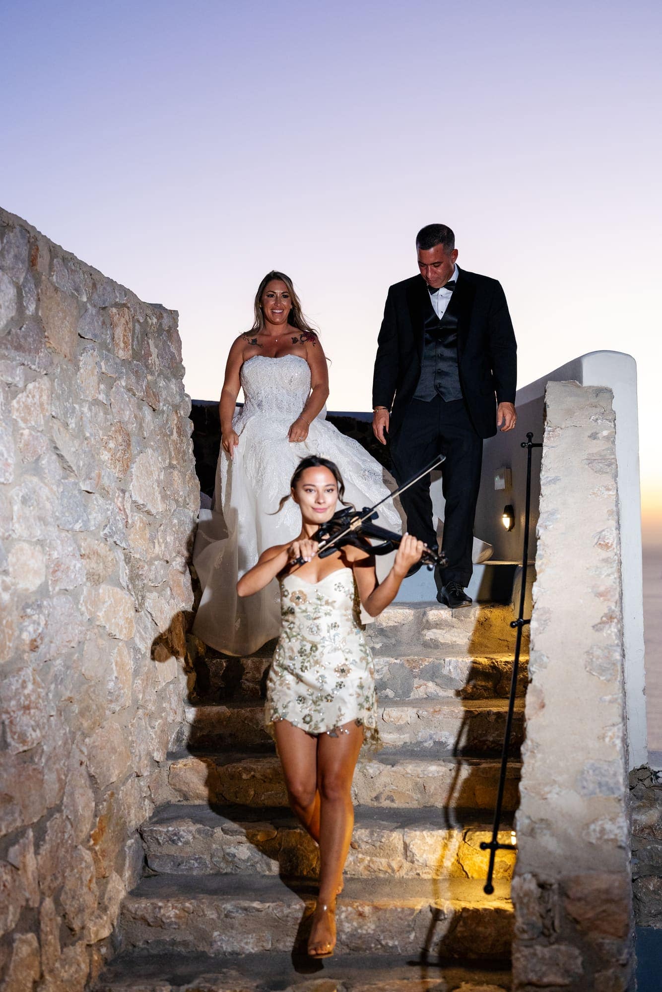 Mary & Chris — the dinner table set under crystal chandeliers, Windmill venue on the caldera, Santorini