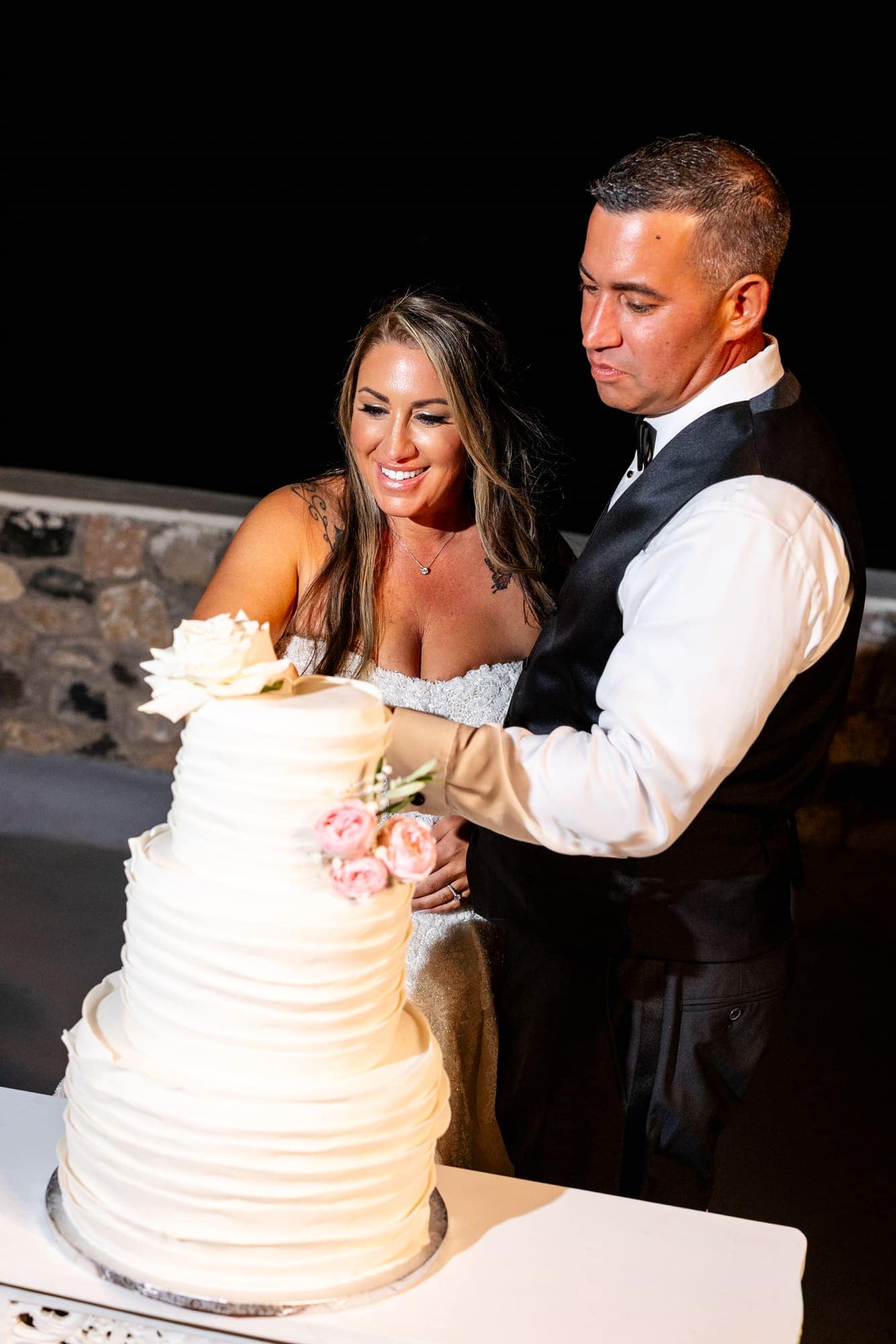 Mary & Chris — the champagne tower, the toasts and the cake, Windmill venue on the caldera, Santorini