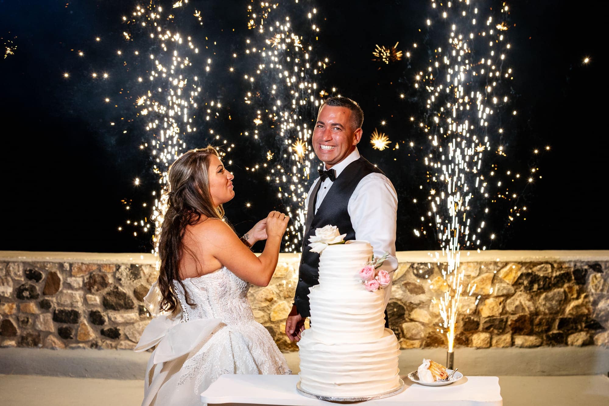 Mary & Chris — the champagne tower, the toasts and the cake, Windmill venue on the caldera, Santorini