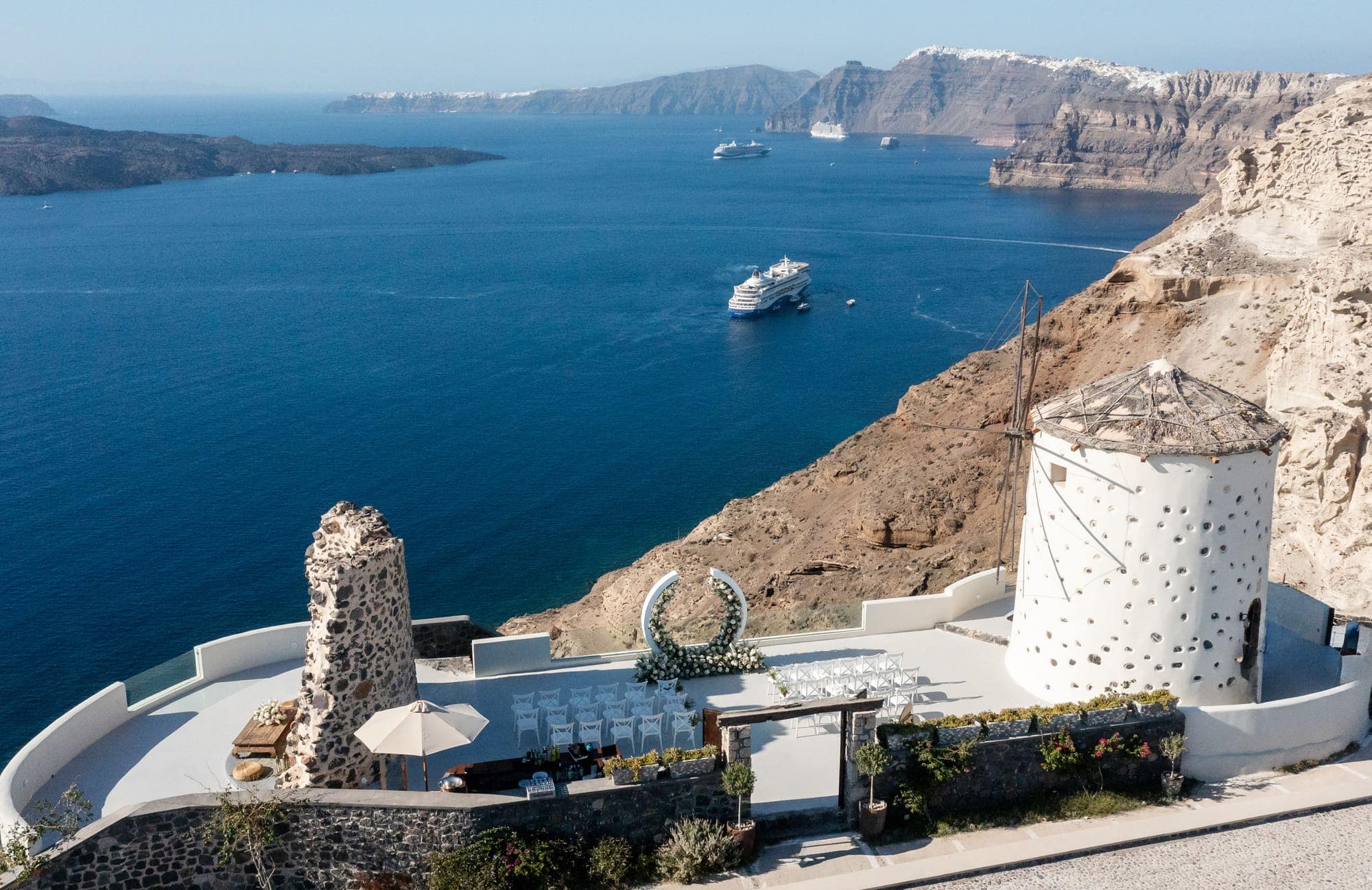 Mary & Chris — the windmill venue seen from above, Windmill venue on the caldera, Santorini