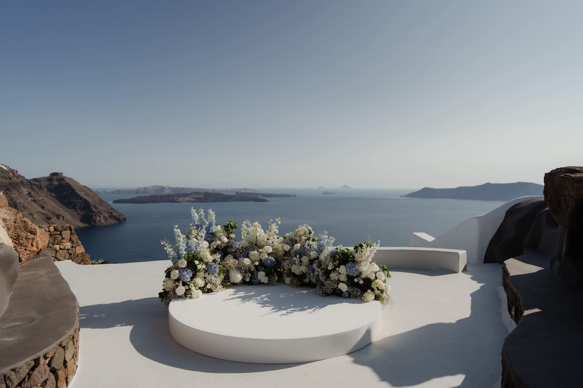 Tina & Kanon — the details and the ceremony circle above the caldera, Cliffside terrace, Santorini