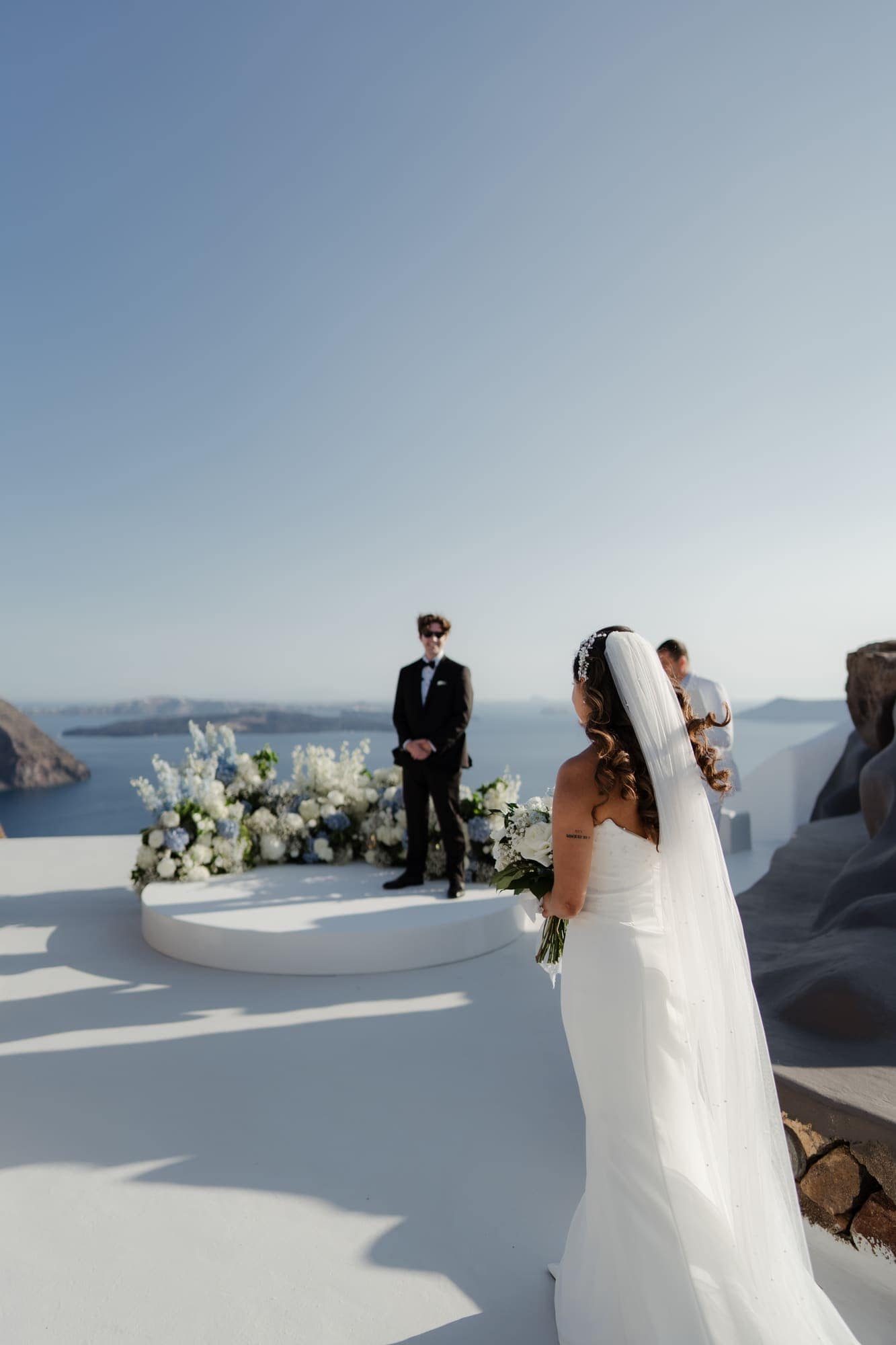 Tina & Kanon — the ceremony and the exchange of vows, Cliffside terrace, Santorini