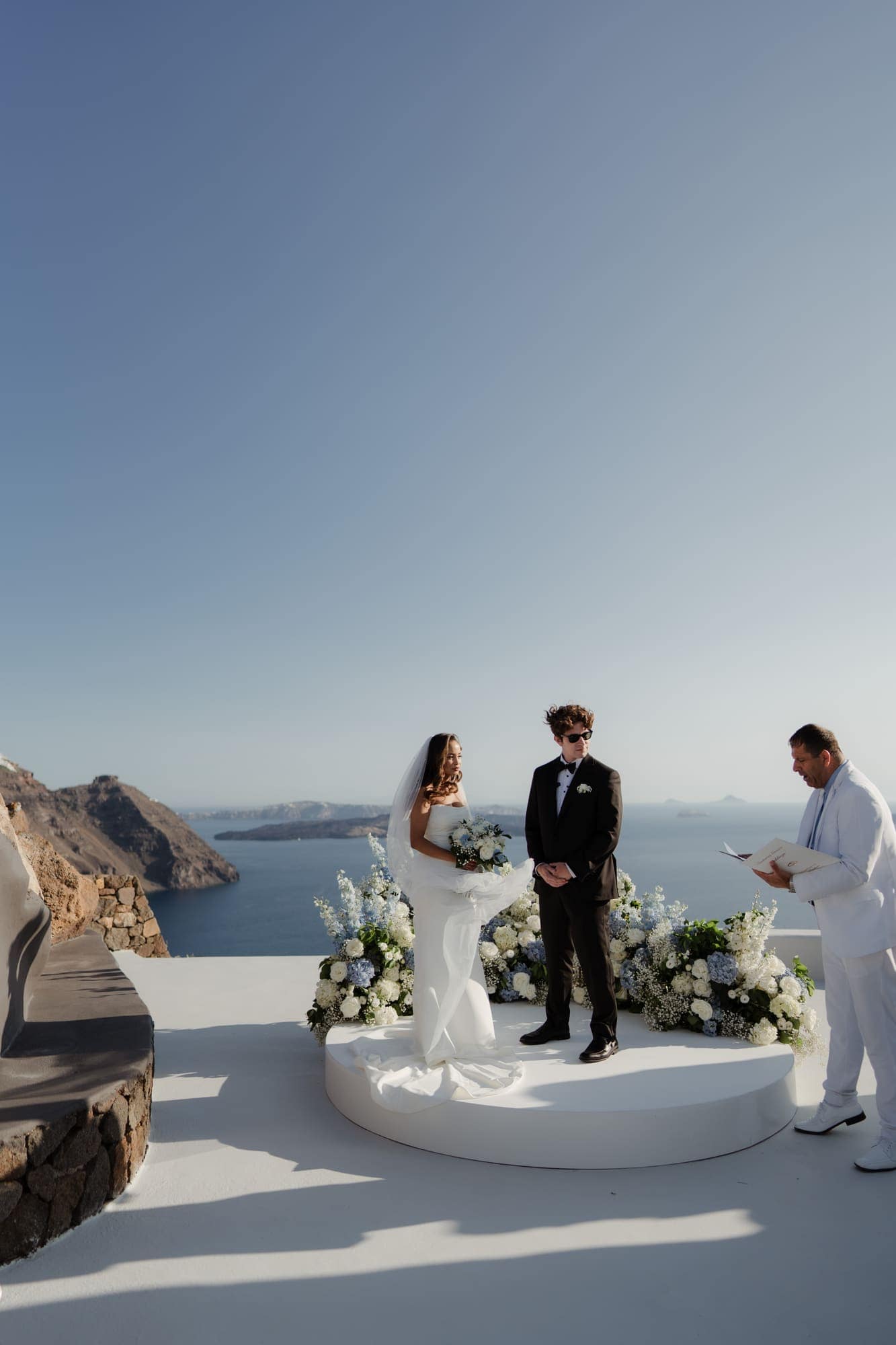 Tina & Kanon — the ceremony and the exchange of vows, Cliffside terrace, Santorini
