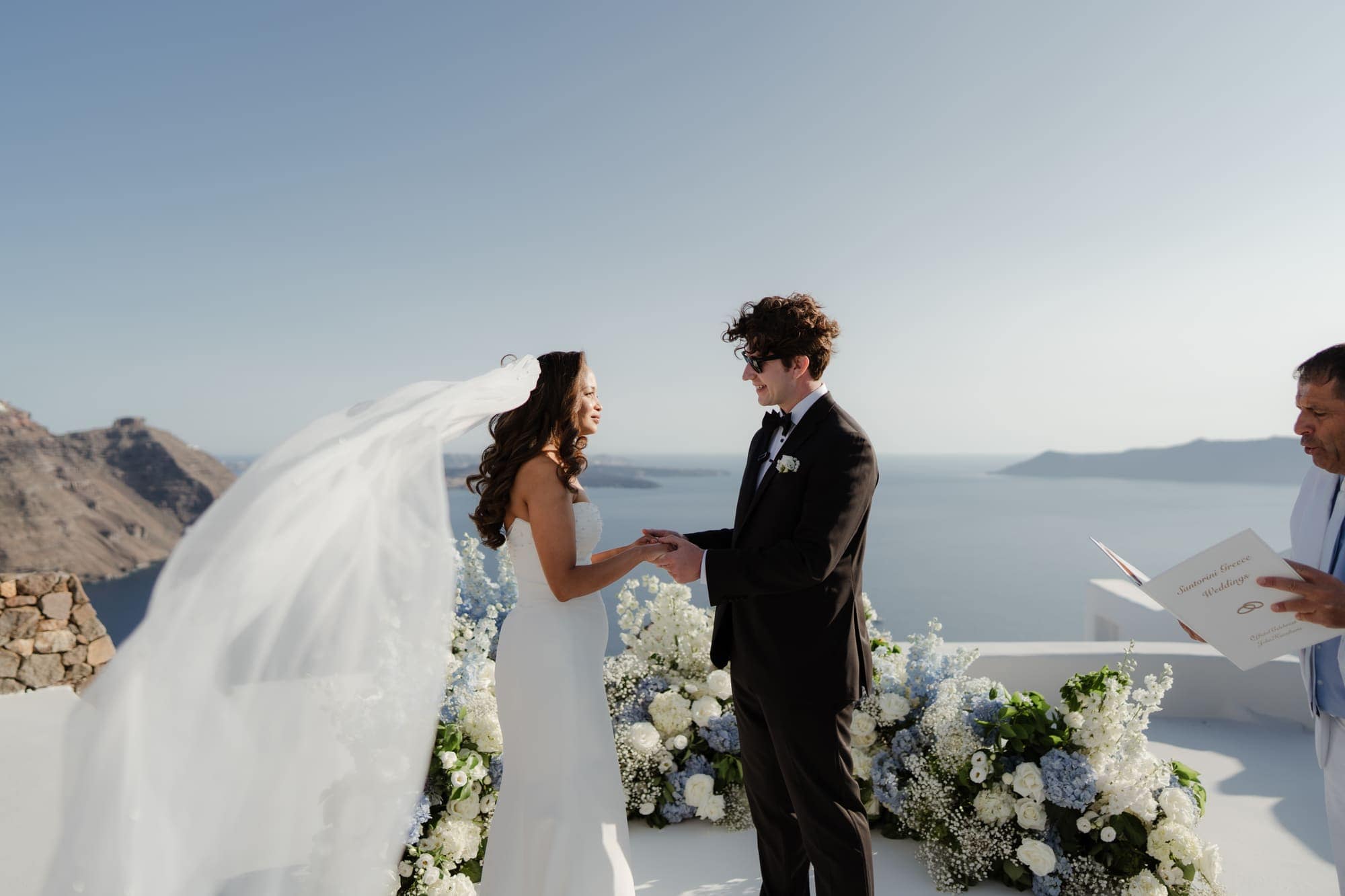 Tina & Kanon — the ceremony and the exchange of vows, Cliffside terrace, Santorini