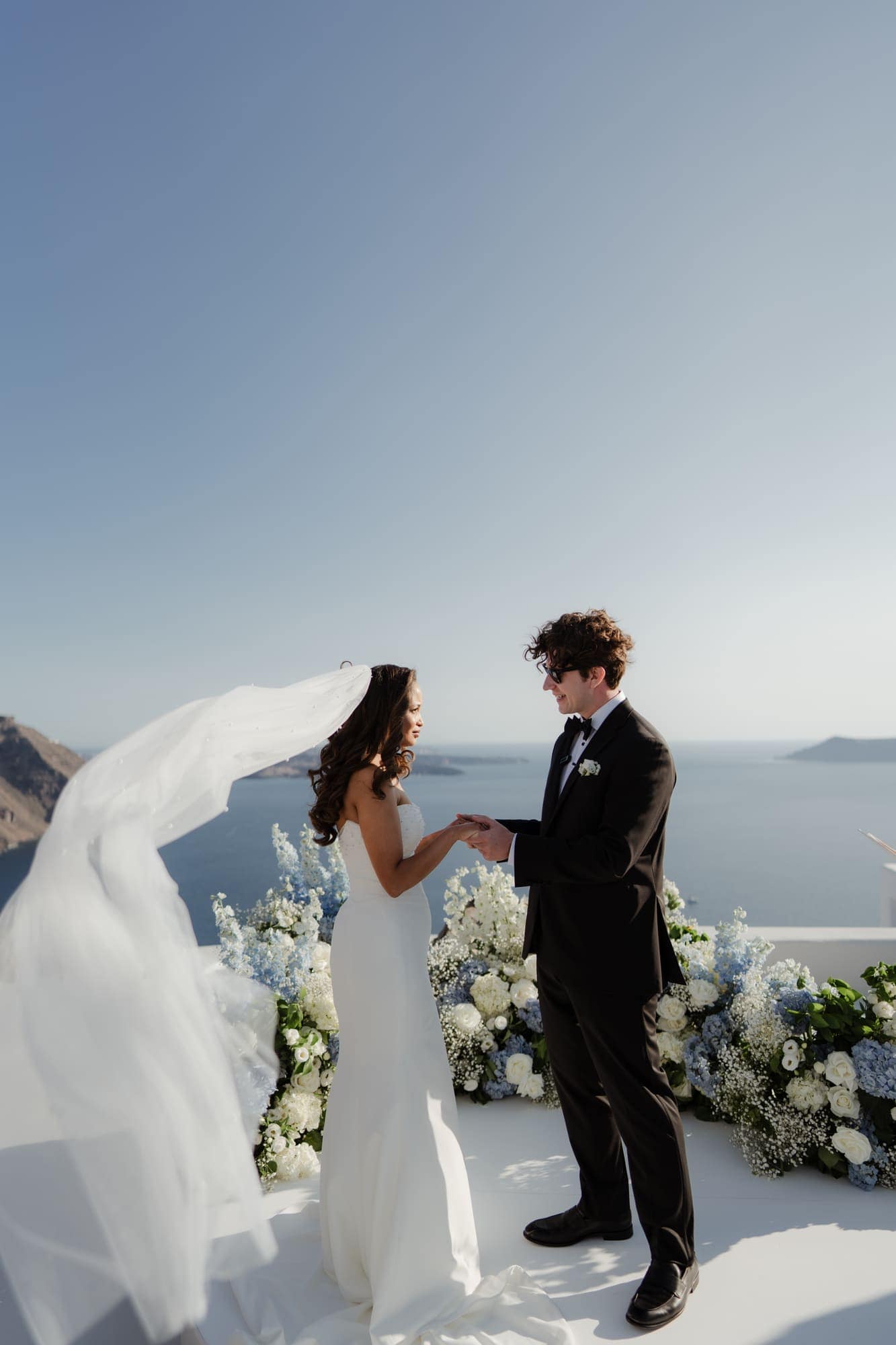 Tina & Kanon — the ceremony and the exchange of vows, Cliffside terrace, Santorini