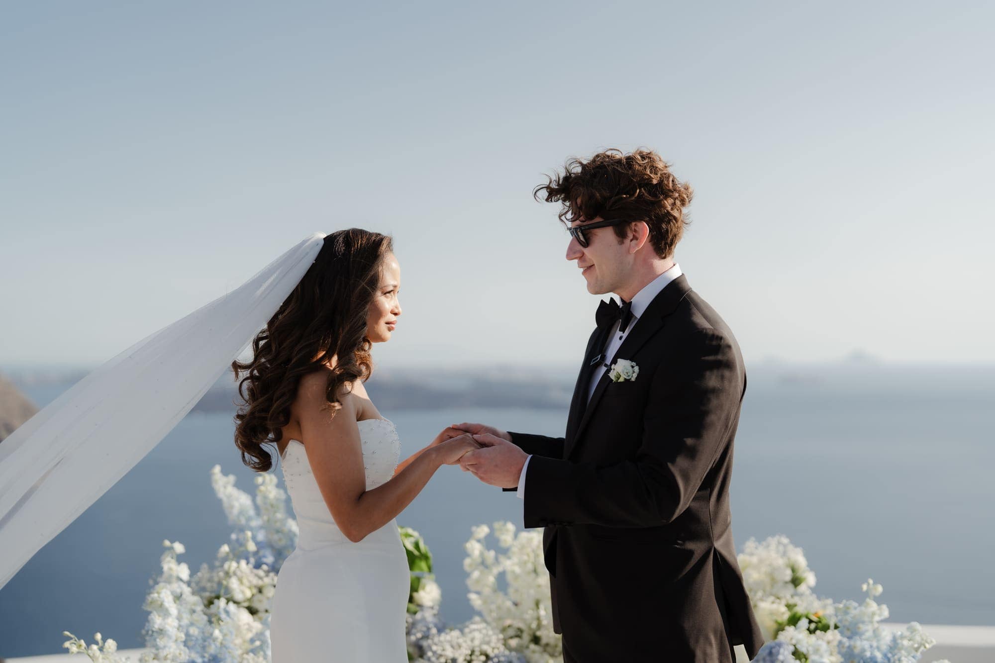 Tina & Kanon — the ceremony and the exchange of vows, Cliffside terrace, Santorini