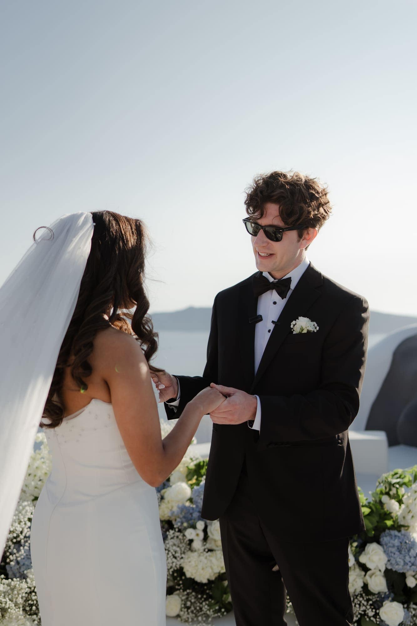 Tina & Kanon — the ceremony and the exchange of vows, Cliffside terrace, Santorini