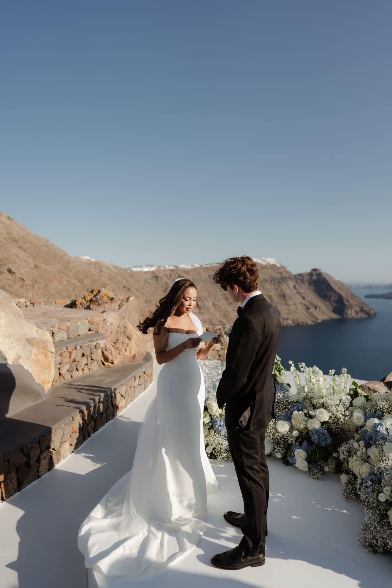 Tina & Kanon — the ceremony and the exchange of vows, Cliffside terrace, Santorini