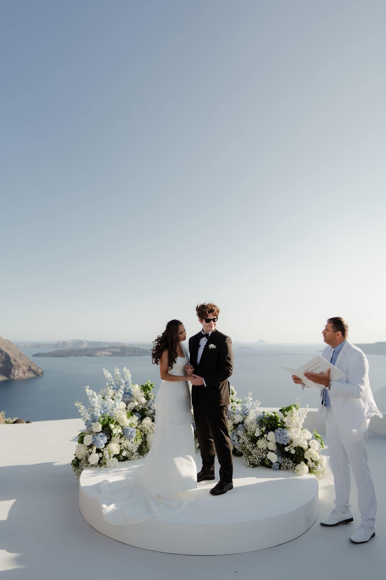 Tina & Kanon — the ceremony and the exchange of vows, Cliffside terrace, Santorini