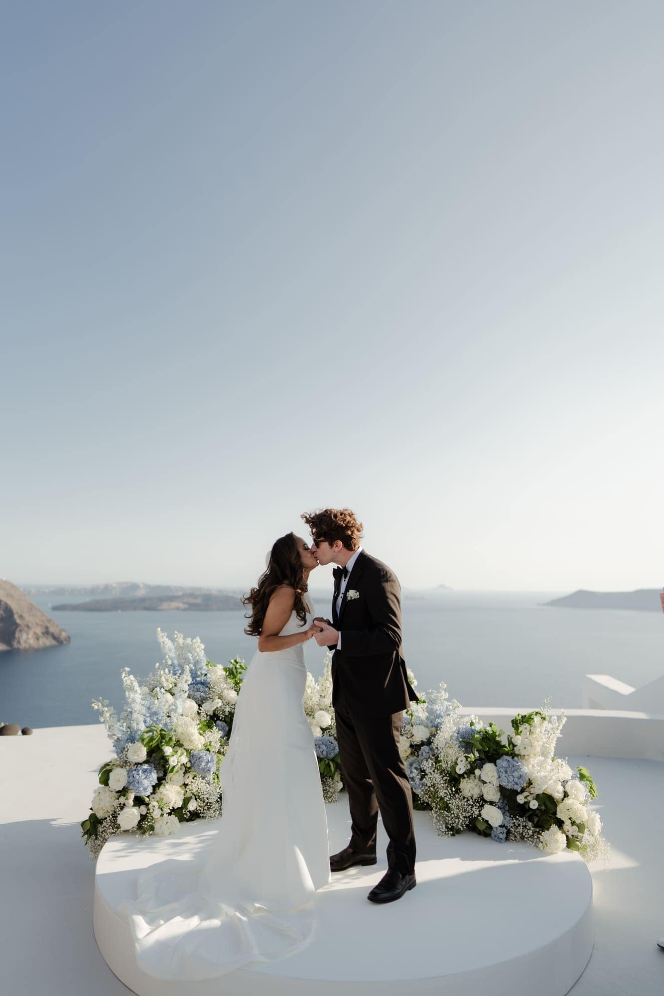 Tina & Kanon — the ceremony and the exchange of vows, Cliffside terrace, Santorini