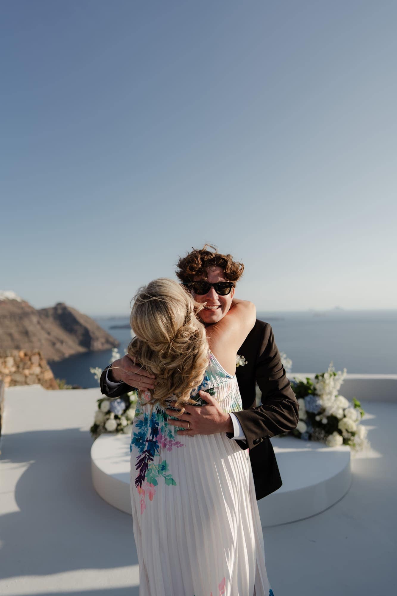 Tina & Kanon — the first portraits and the family who travelled with them, Cliffside terrace, Santorini