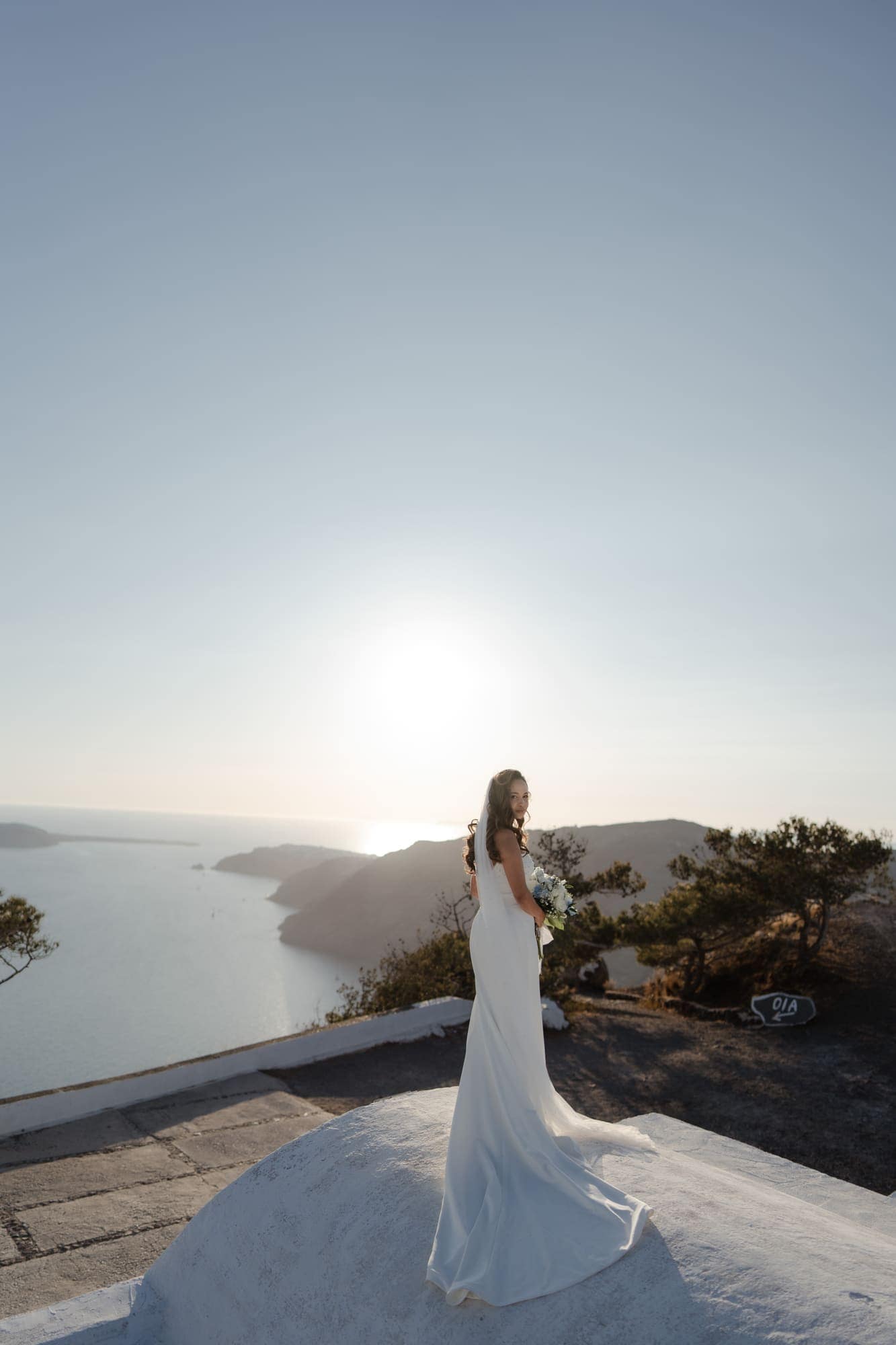 Tina & Kanon — golden hour on the whitewashed terraces, Cliffside terrace, Santorini