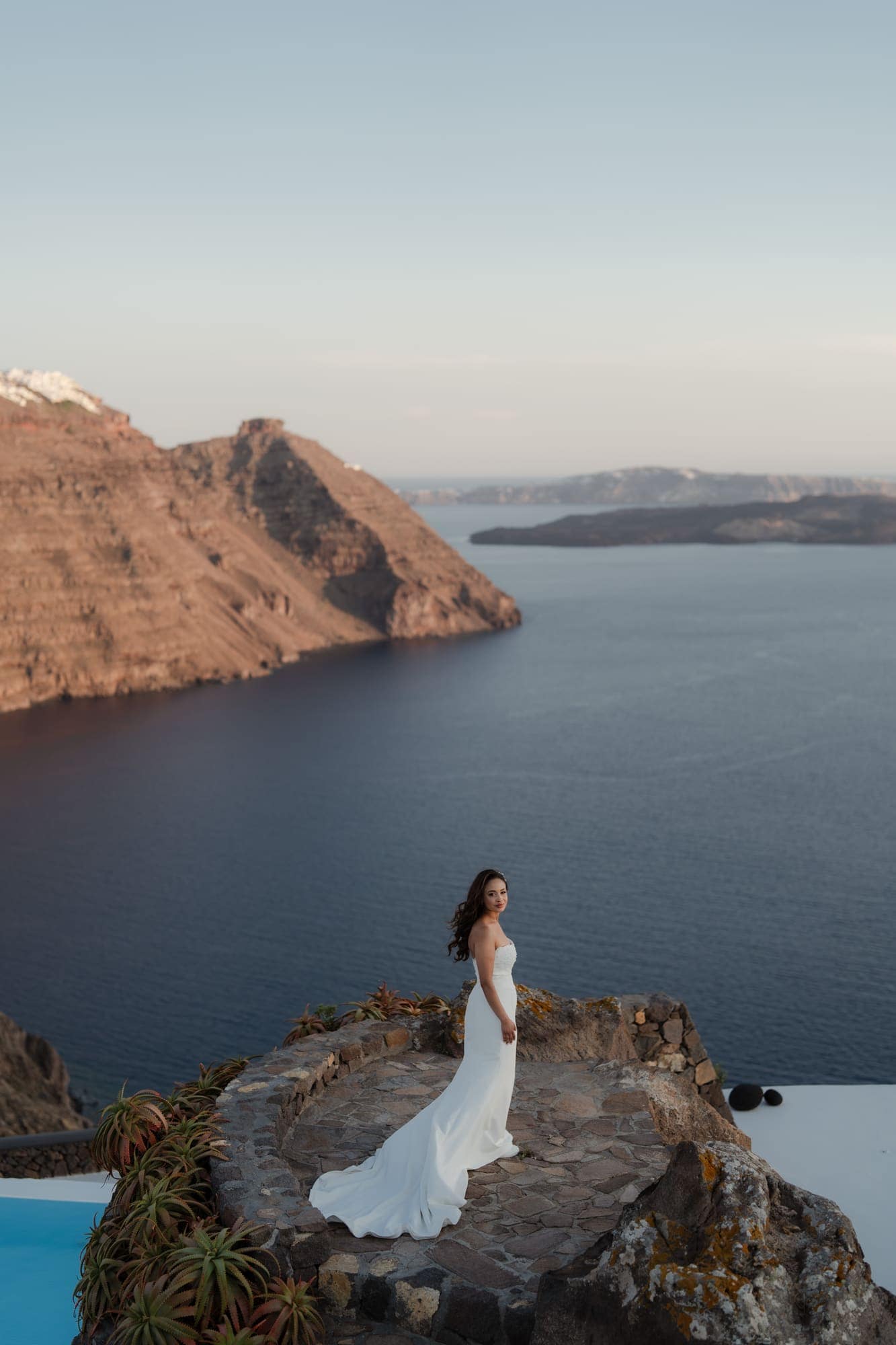 Tina & Kanon — the last portraits on the caldera edge, Cliffside terrace, Santorini