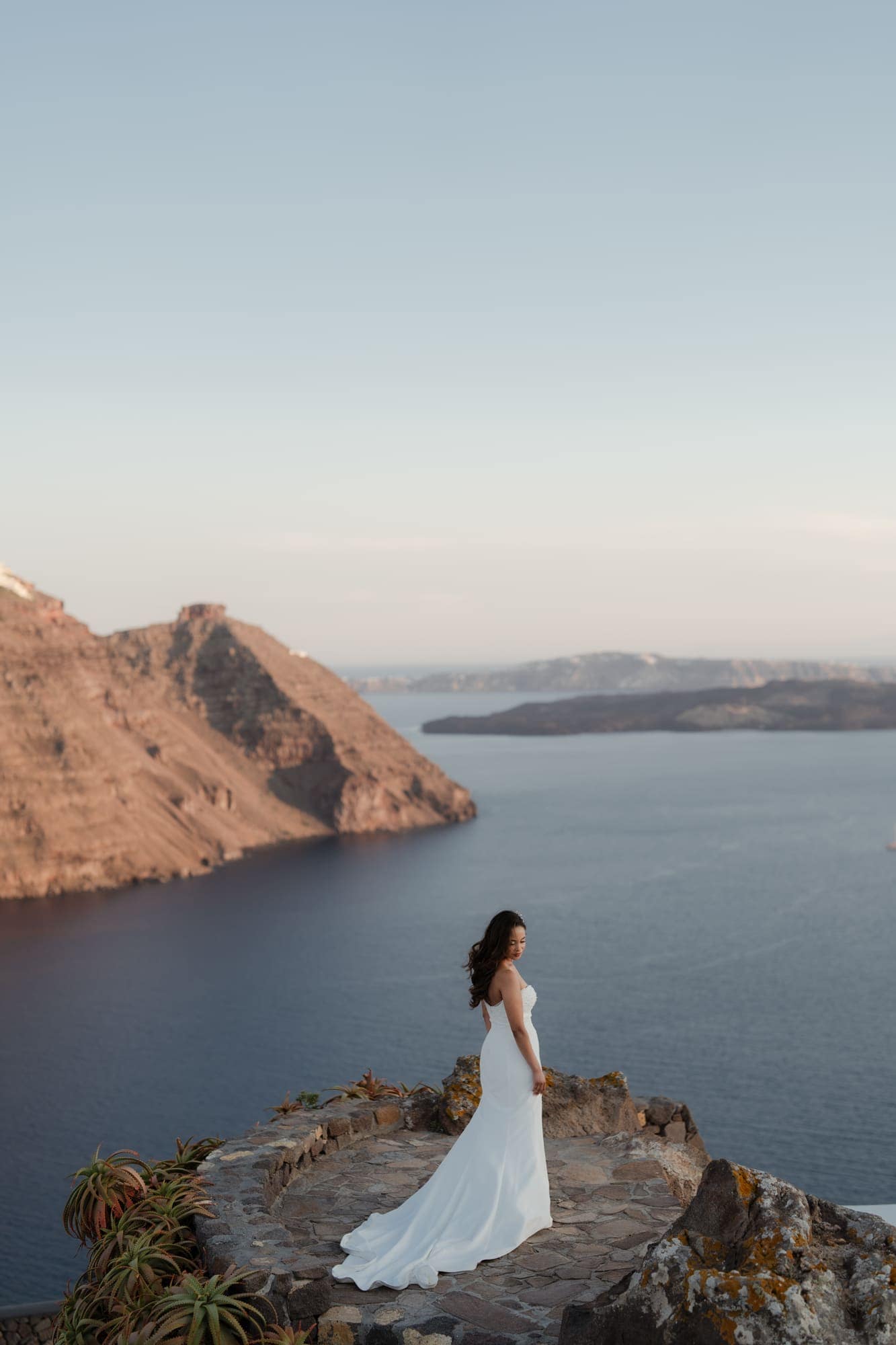 Tina & Kanon — the last portraits on the caldera edge, Cliffside terrace, Santorini
