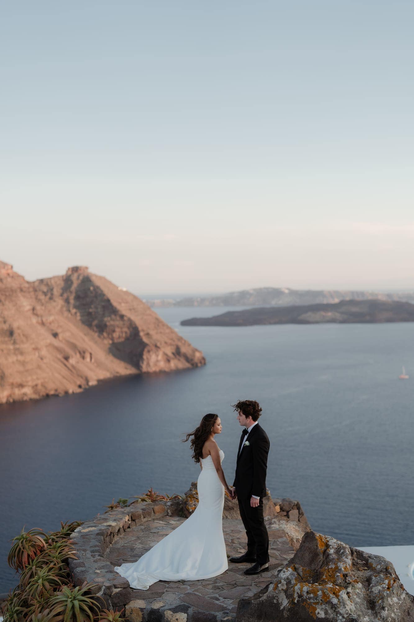 Tina & Kanon — the last portraits on the caldera edge, Cliffside terrace, Santorini