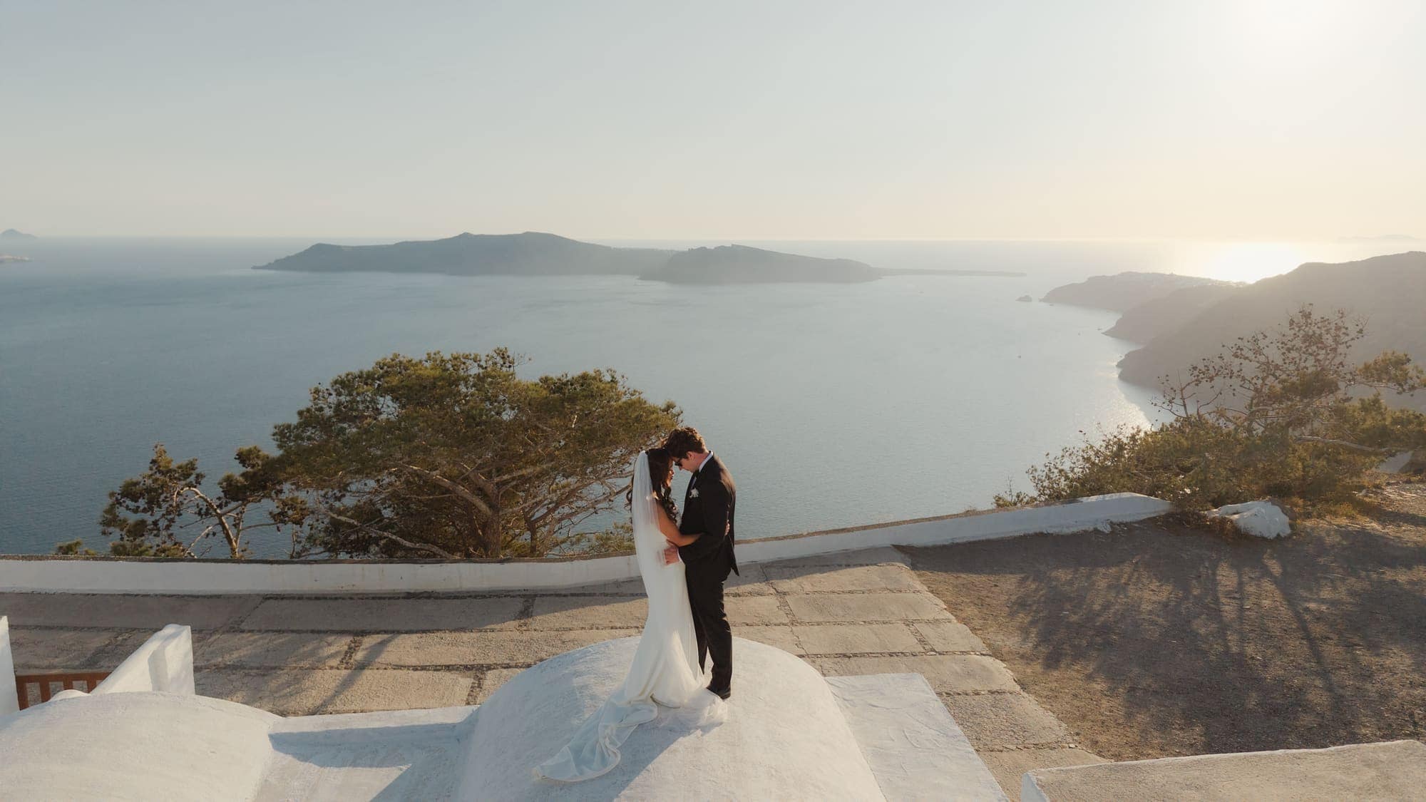 Tina & Kanon — Two of them, a violin and the whole caldera, Cliffside terrace, Santorini